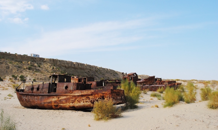 Rusty fishing boats on the former depth of the Aral Sea, close to Moynaq.