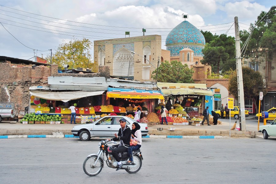 Street in Kerman. In the background, the Mushtaq Ali Shah mosque. Iran.